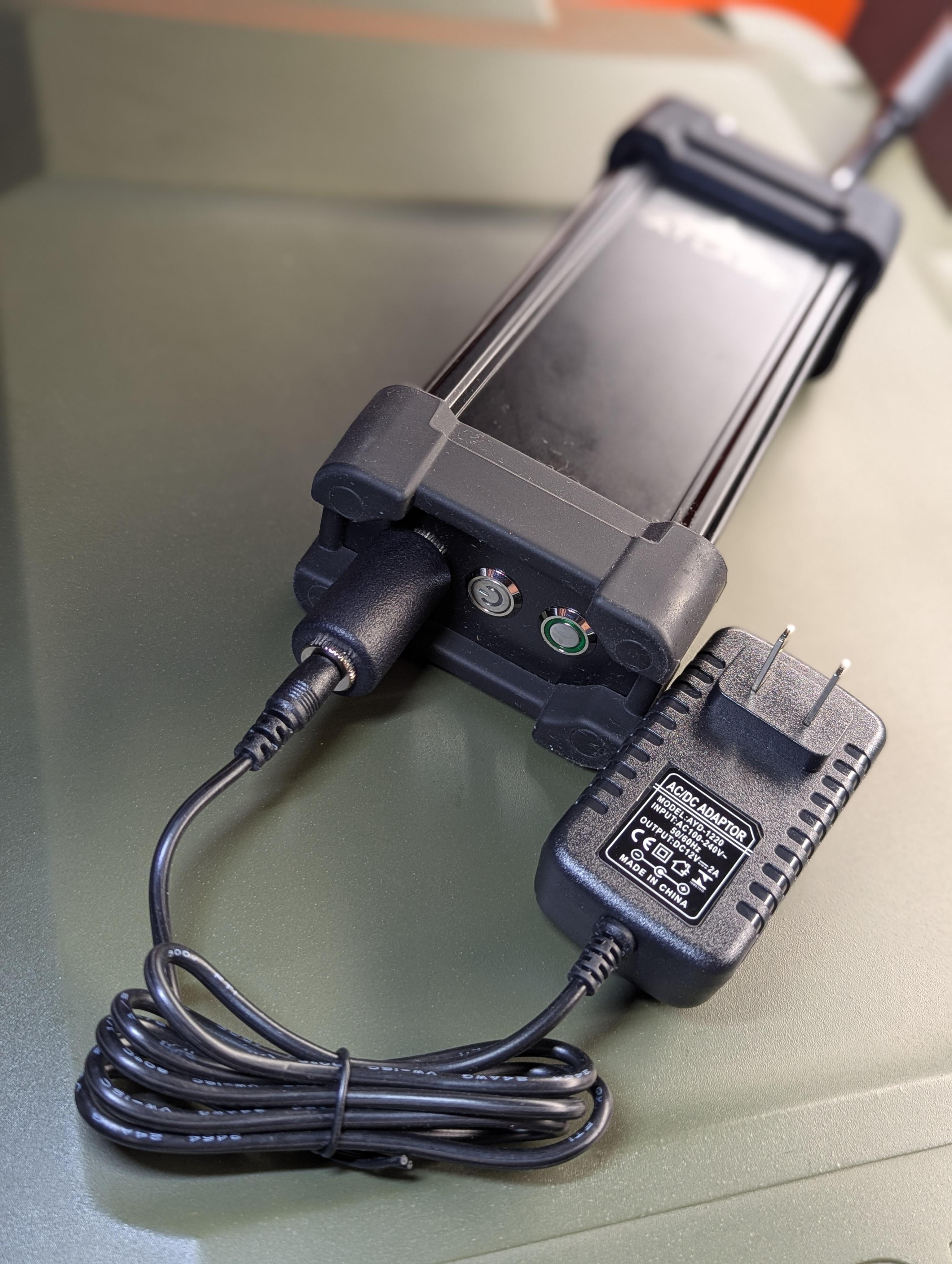 AT Labs RC-2 rapid charger connected to an RM-1/RM-2 radio and powered by the included 12V 2A wall adapter